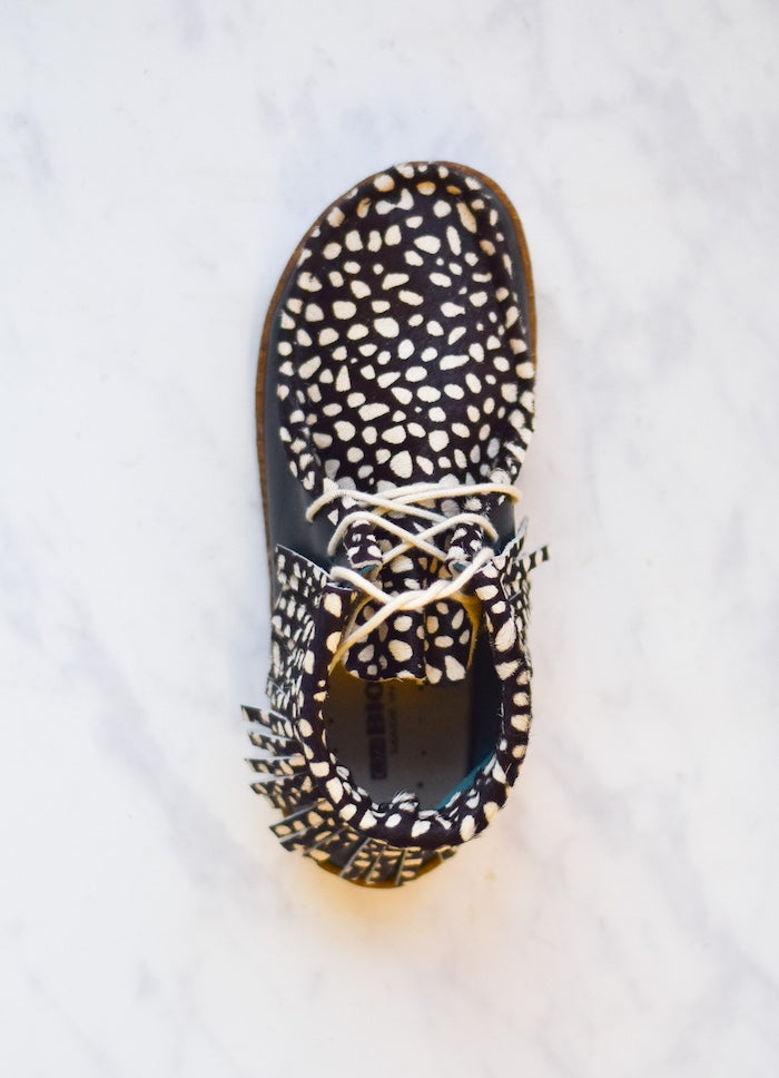 black and white animal print fringed boot made from a kit