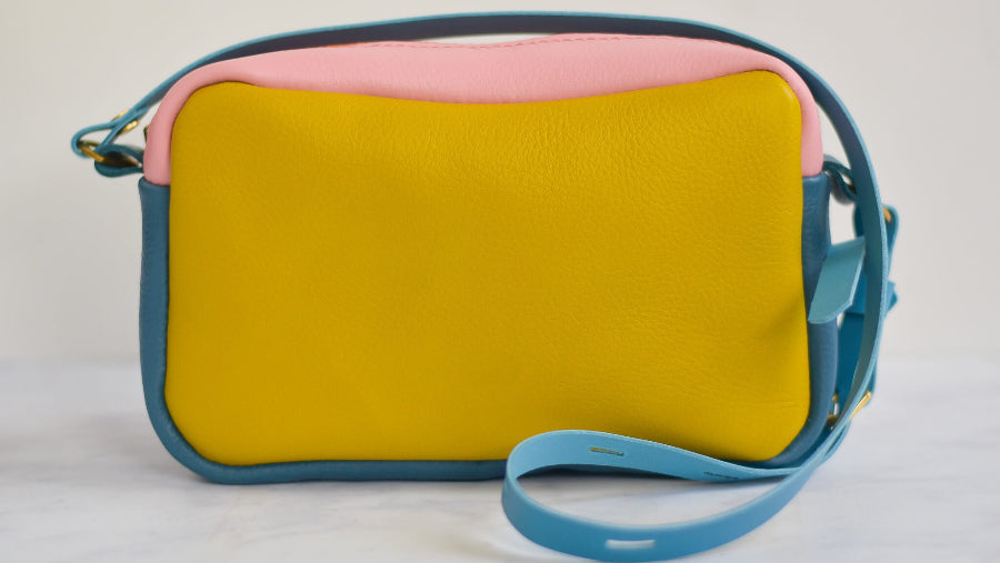 yellow pink and blue boxy leather bag made from a kit