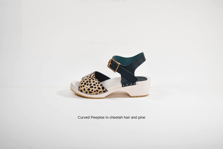 animal print wooden sandal handmade from a kit on white background