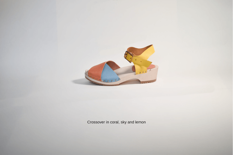 Colorful leather sandal with a strap on a white background