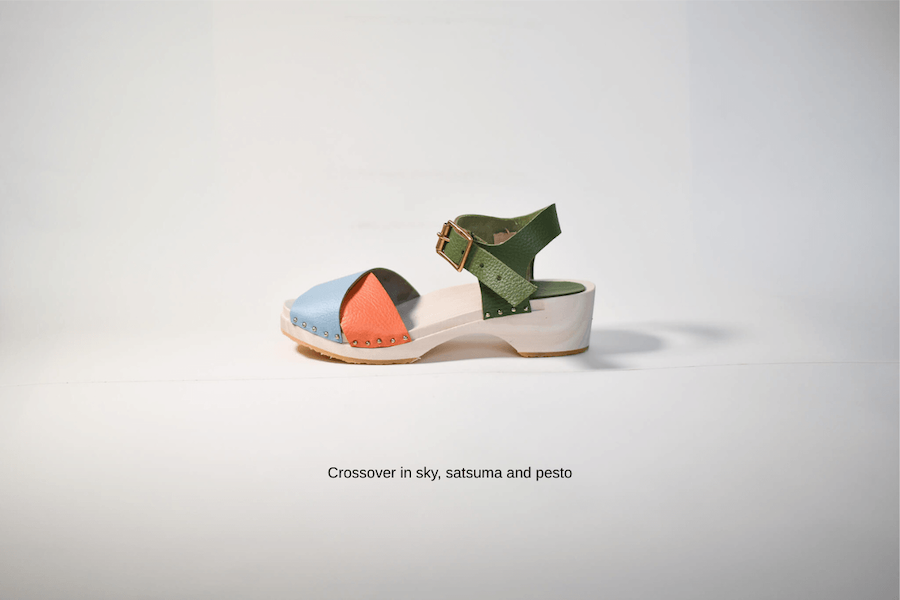 Colorful sandal made from a kit with a green strap on a light gray background