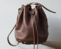 Brown woven leather bucket bag made from the Leather Needle Thread stitchless bucket bag PDF pattern