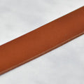 dark tan veg tan leather strap close up