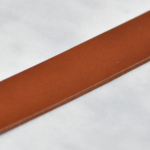 dark tan veg tan leather strap close up